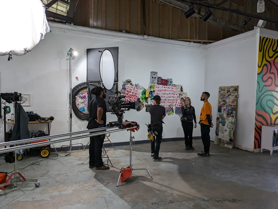 Camera and dolly track in a gallery studio