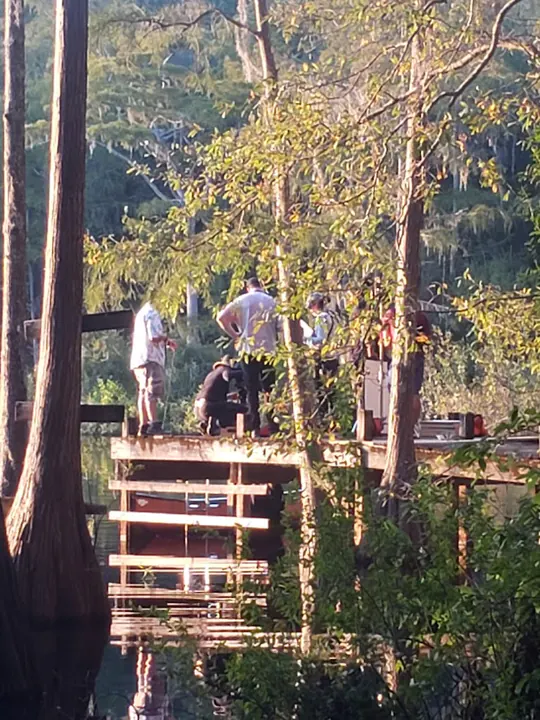 Crew on a cypress swamp dock